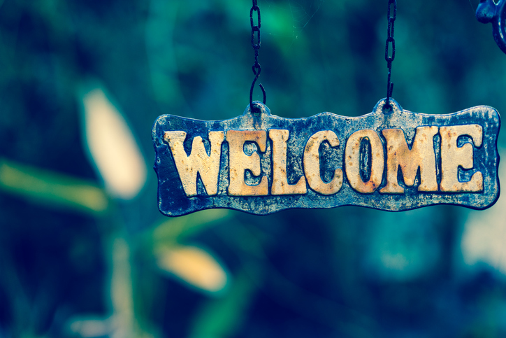 WELCOME sign on wooden board