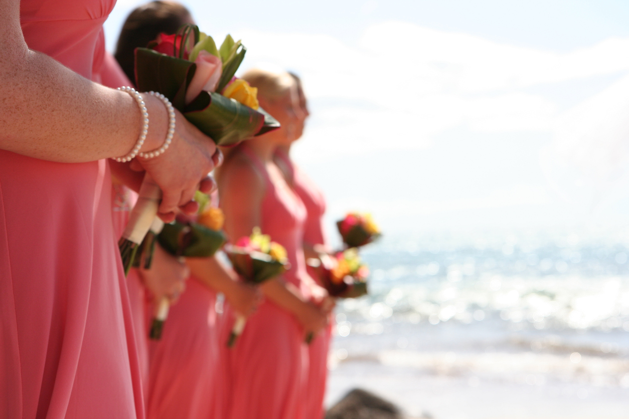 Bridesmaids Holding Bouquets on a sunlit beach