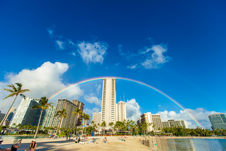 Rainbow over hotels in Waikiki Beach.