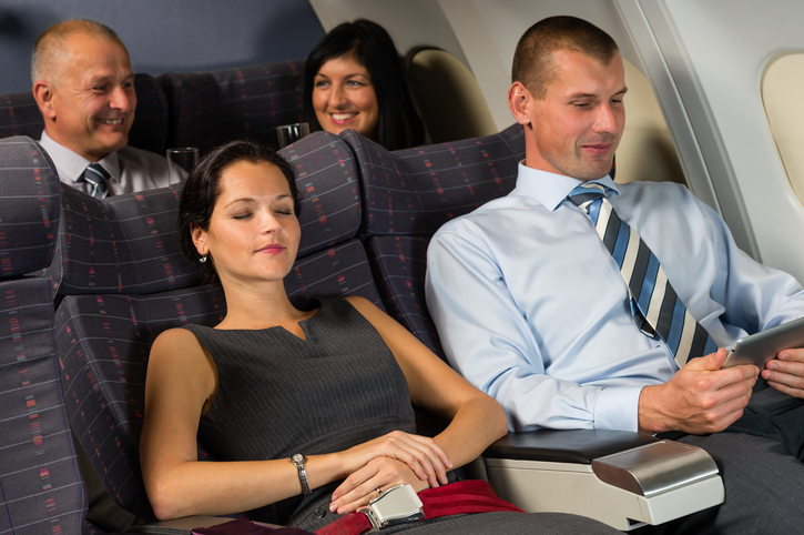 Airplane passenger relax during flight cabin sleep